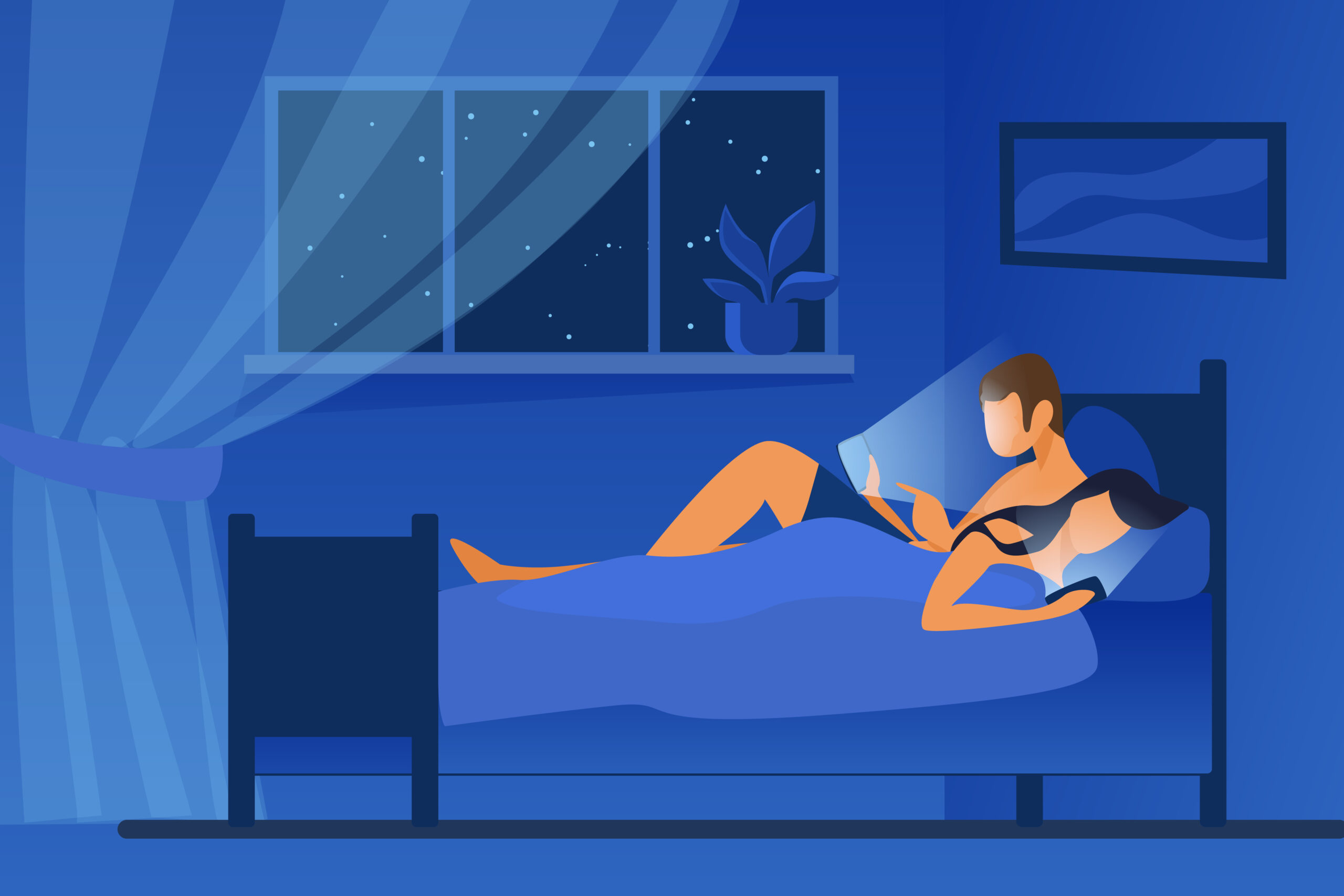 couple in bed at night scrolling through mobile devices